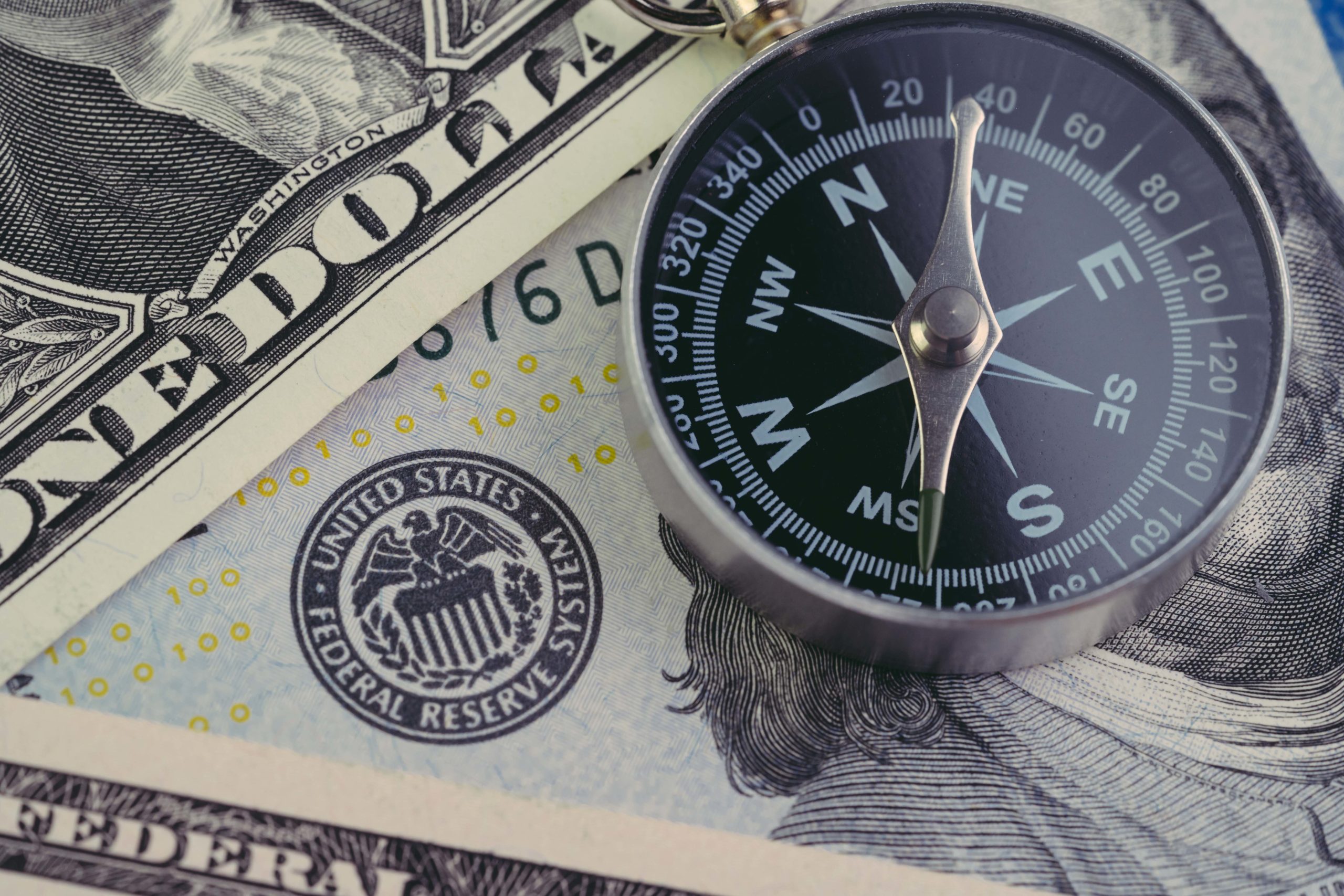 US Dollars and Compass