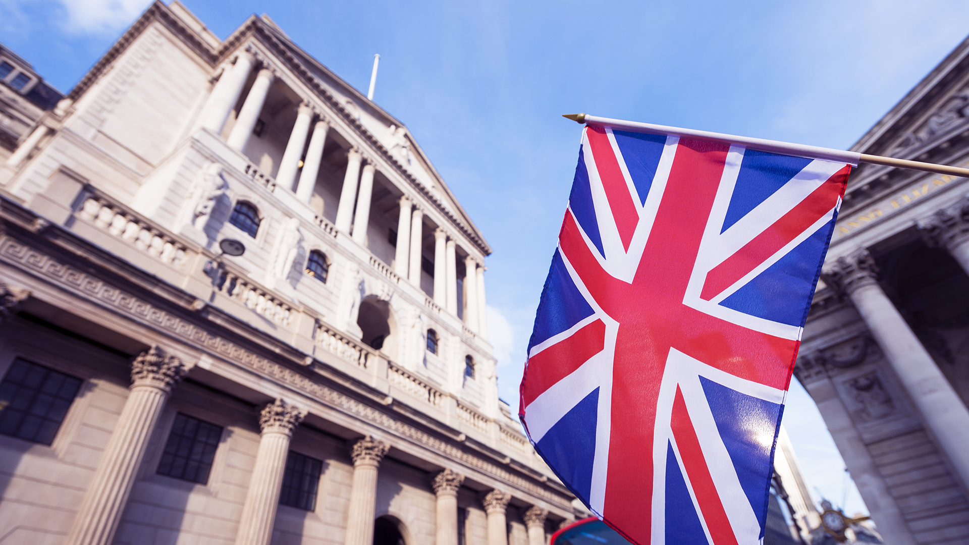 Bank of England building displaying the UK flag