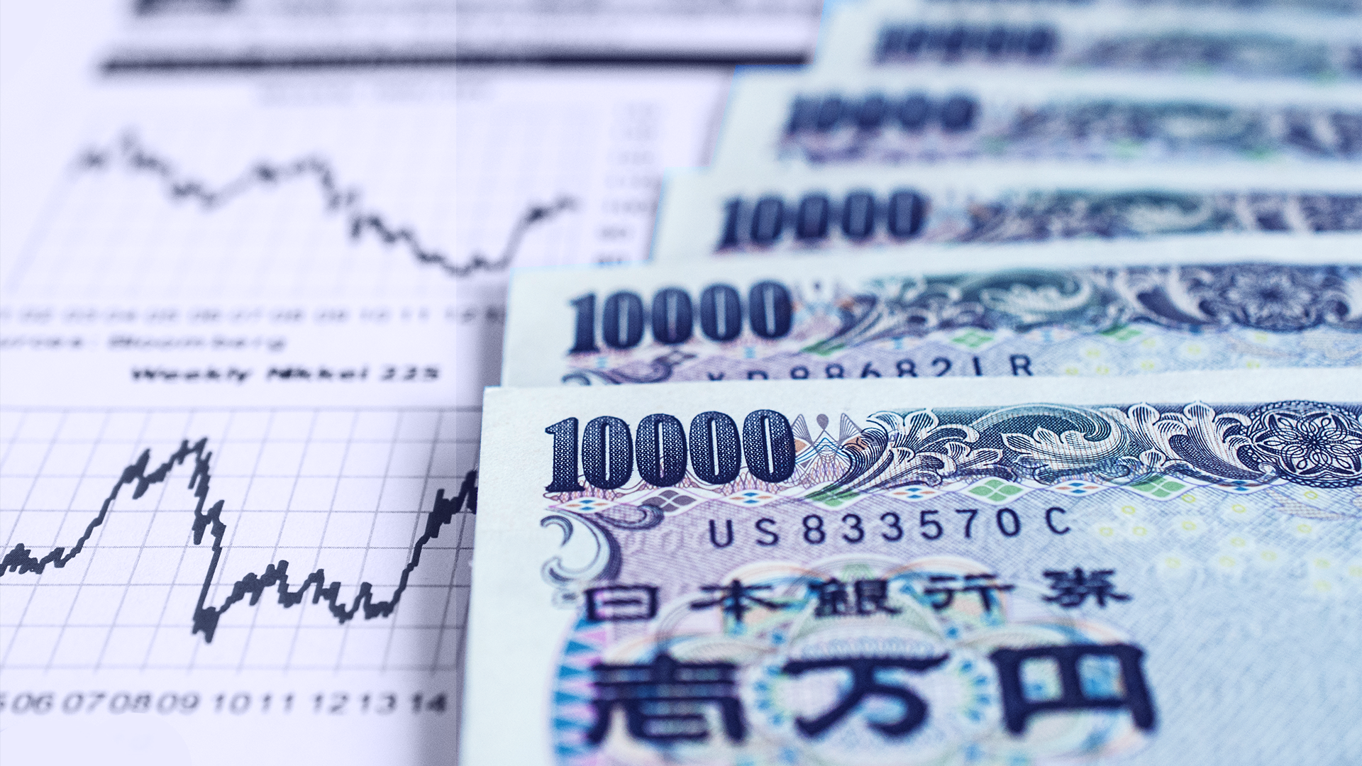 10000 yen bills with a white financial chart background
